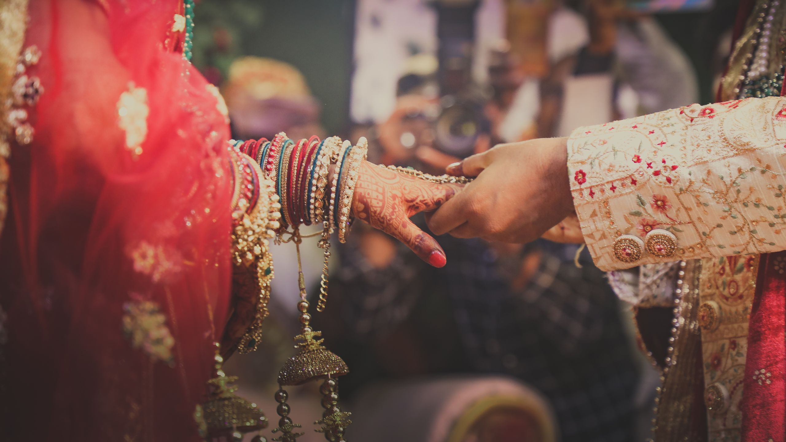 husband putting a ring on his wifes finger