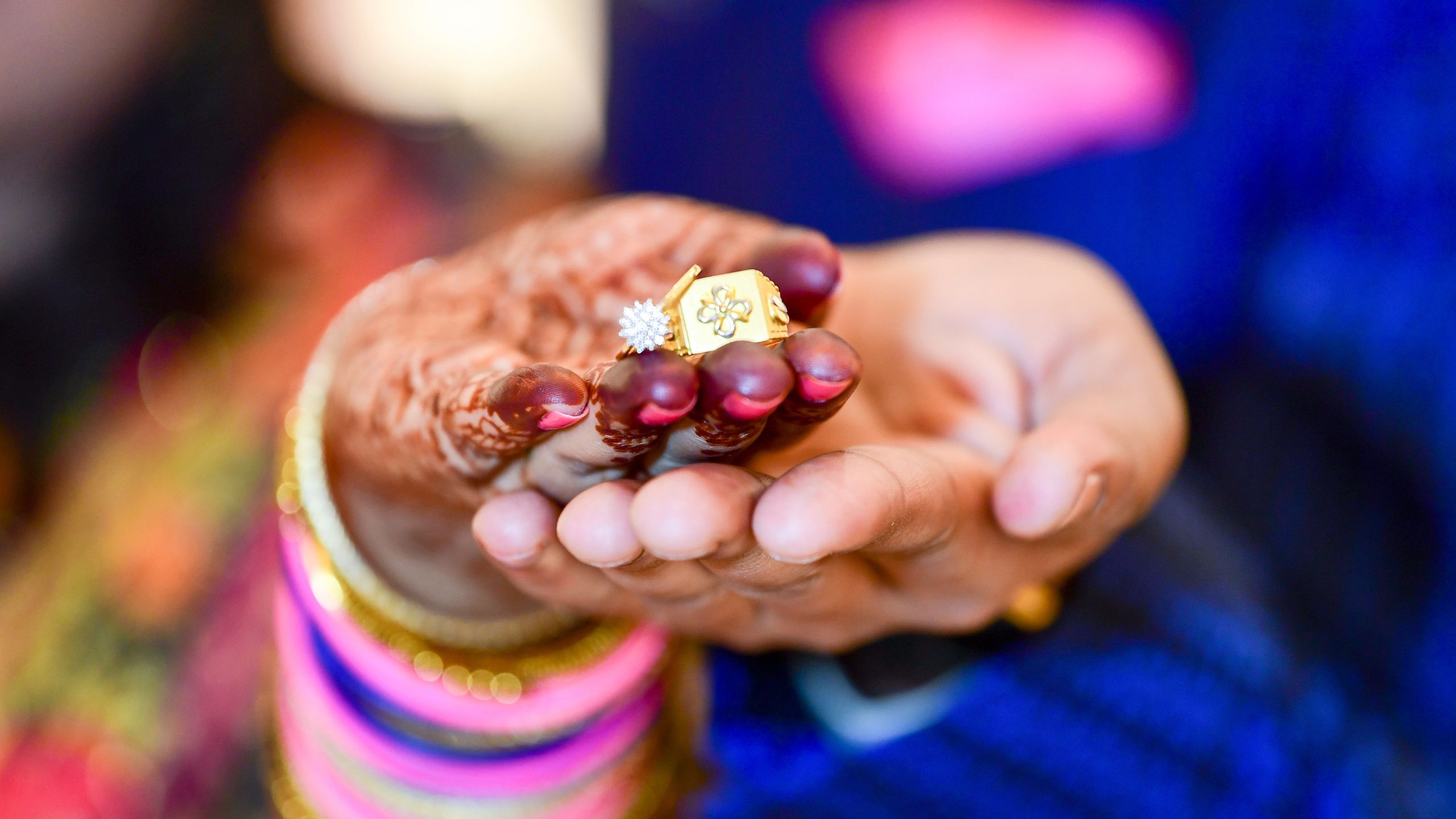 couples stretching their hand with wedding rings in it during wedding ceremony