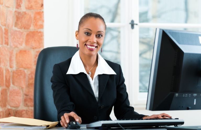 How to get film production lawyer jobs A young female lawyer sitting in her office and using a computer to research How to get film production lawyer jobs